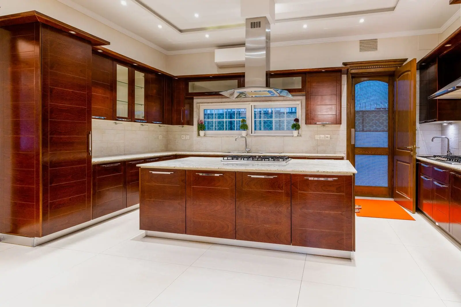 Spacious kitchen with rich wood cabinets and a central island